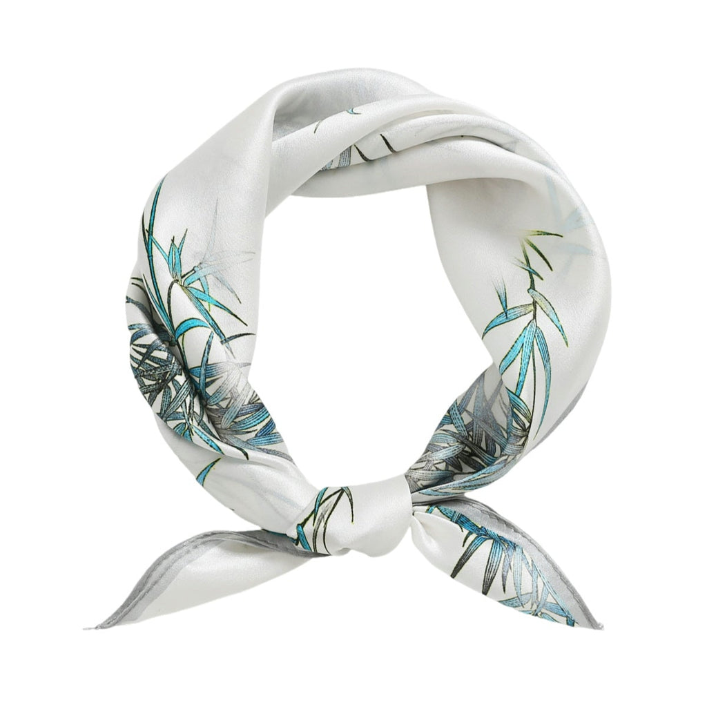 White scarf with green leaf and panda pattern on a white background