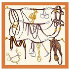 Flat view of the tack room silk scarf with bridles bits stirrups and buckles inside an orange border
