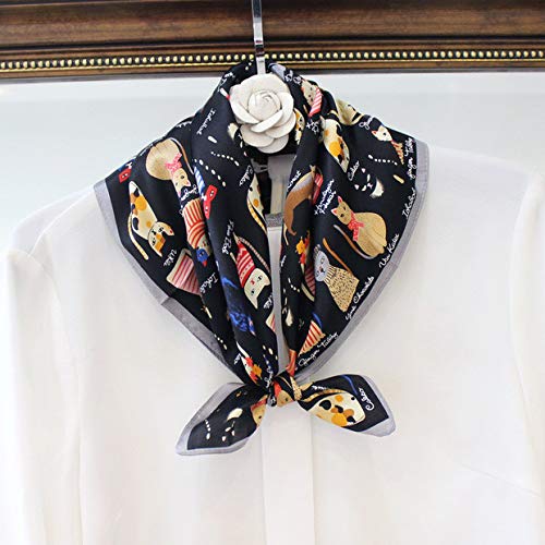 Cat print square tied at the collar of a white blouse on a hanger with a fabric flower
