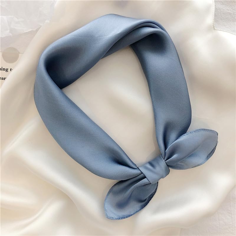 Dusty blue silk square knotted and laid on ivory silk, glossy charmeuse face turned up