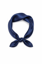 Navy silk charmeuse neckerchief knotted into a loop with a deep glossy finish