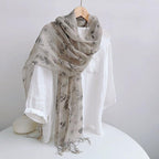 Ink floral linen scarf draped, showing the softer drape of the finer yarn