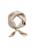 Champagne beige silk charmeuse neckerchief tied in a loop, warm sand tone with no print