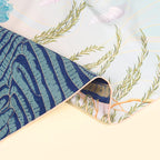 Detail of the reverse side showing the wetland motif in deep blue and jade