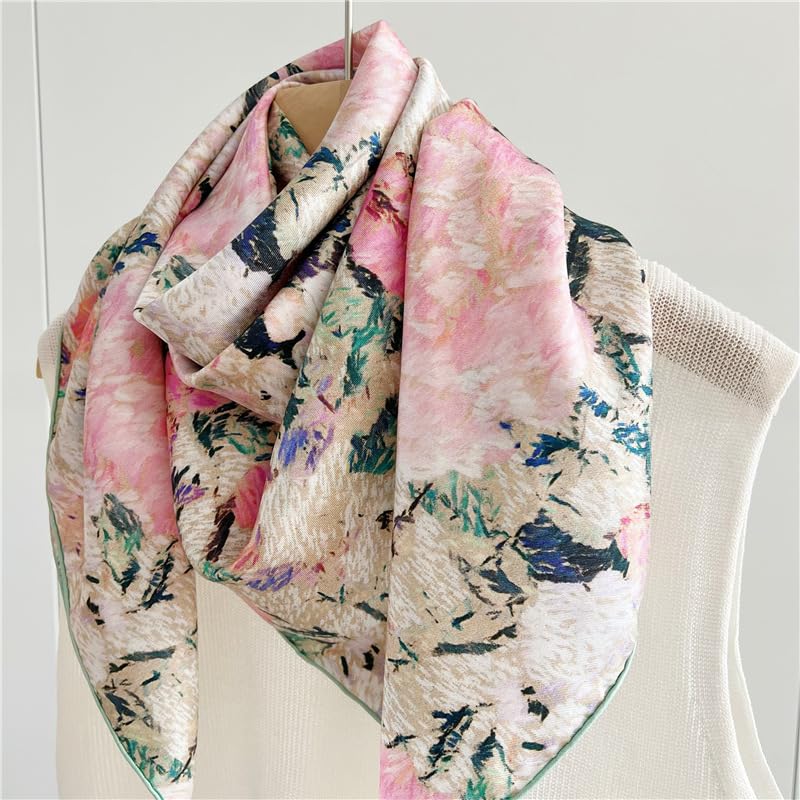 The painterly floral silk scarf draped over a cream knit