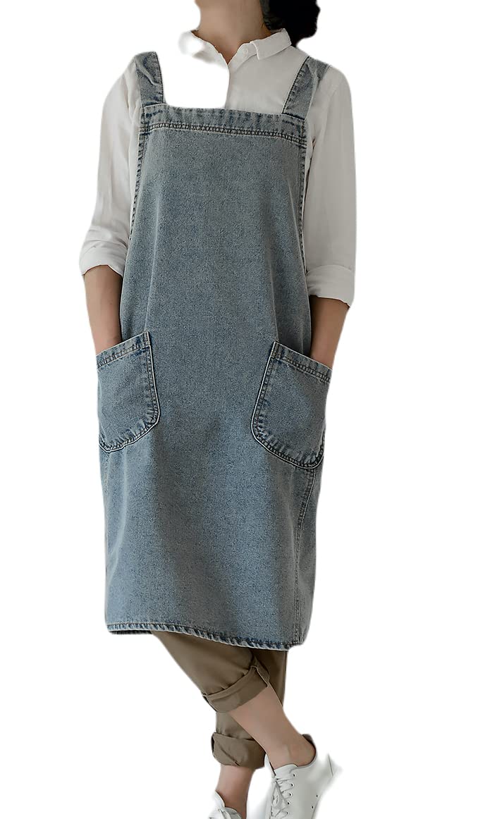 Woman in the pale washed denim pinafore apron carrying a canvas