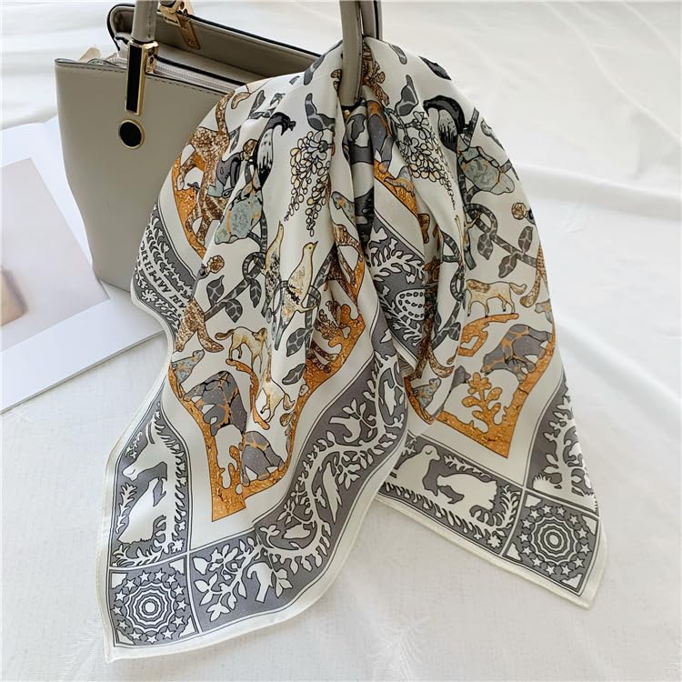 Cream animal-print square knotted onto the handle of a beige handbag
