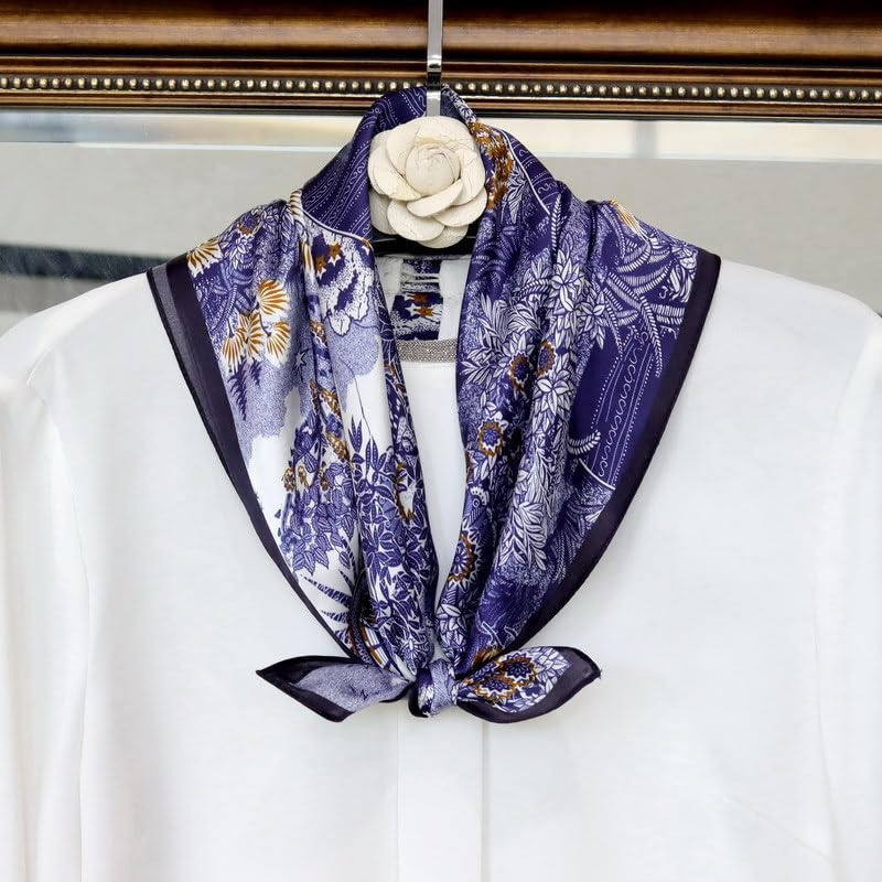 Blue toile square knotted over a white blouse on a hanger, camellia pin above