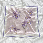 The full square flat, purple irises with yellow markings on mauve inside a white band
