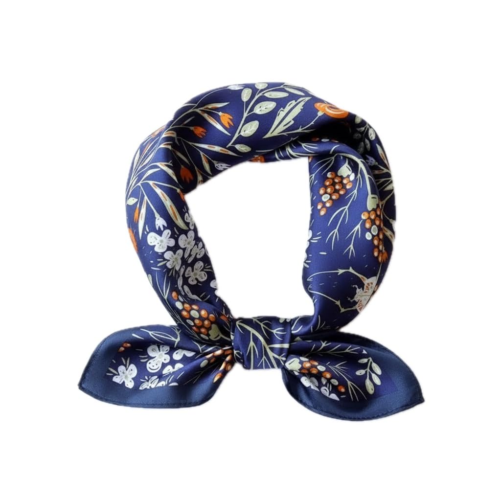 Navy garden-print square coiled into a loop and knotted, orange blooms scattered over