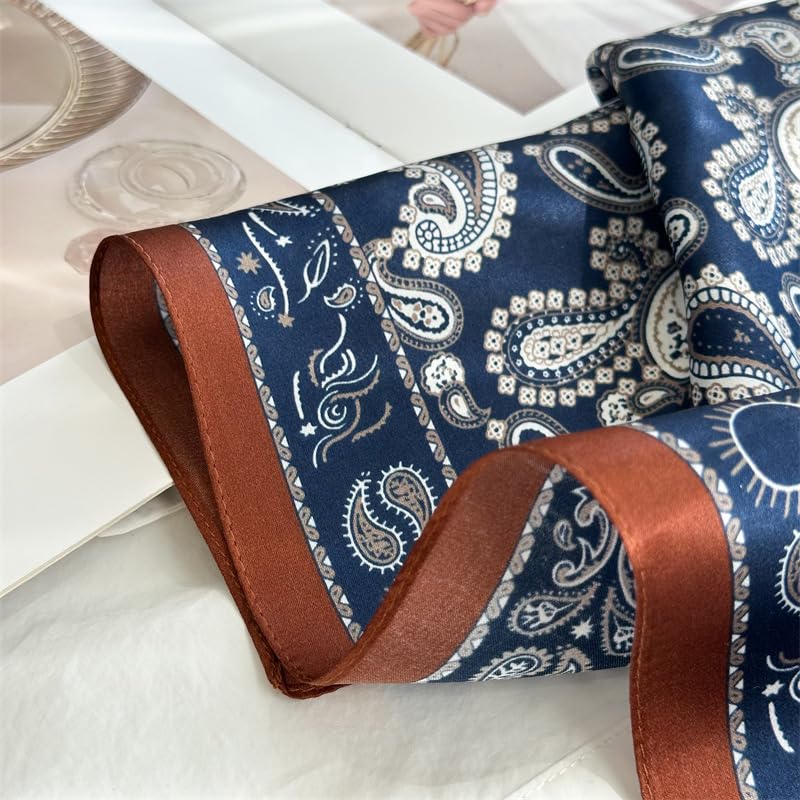 The rust border band rolling over a fold with navy paisley on either side
