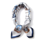 White nautical square coiled into a loop and knotted, navy border on the tails