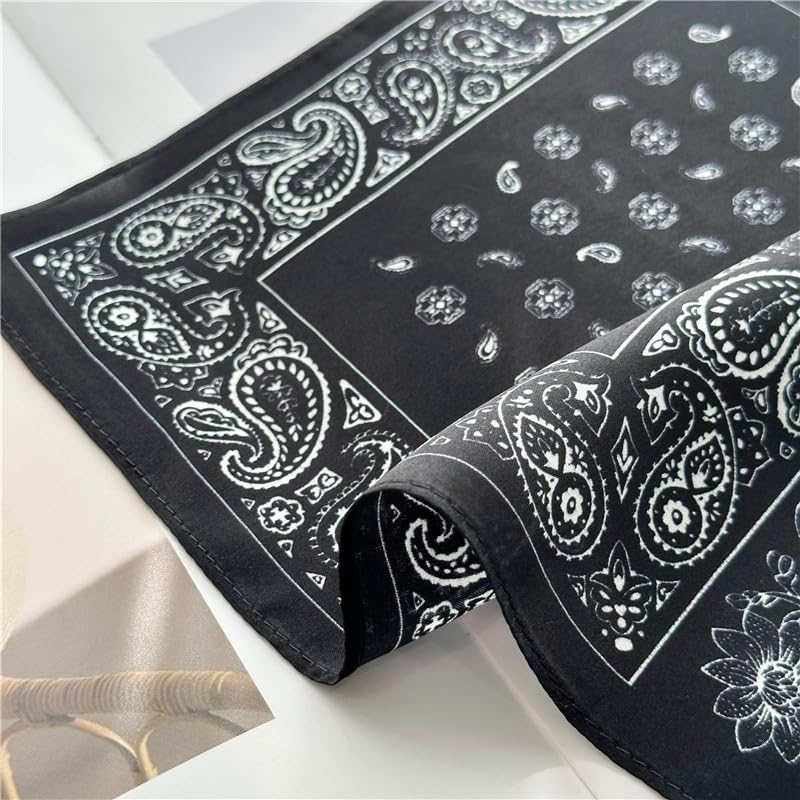Folded black square showing the teardrop centre field beside the paisley border