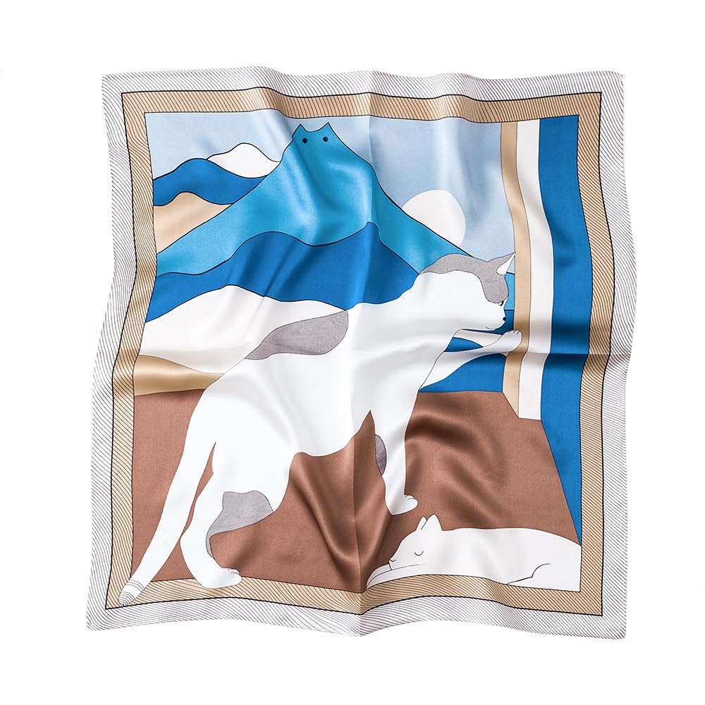 Silk square printed with blue mountains drawn as a cat face and a white cat lying below