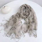 Detail of the knotted fringe on the ink floral linen scarf