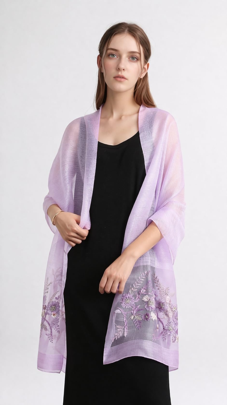 Model wearing the lavender embroidered shawl open over a black dress