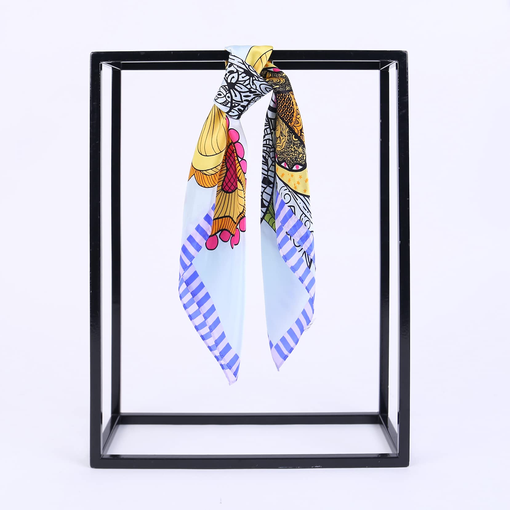 Blue floral square hung over a black frame, striped border running down the tails