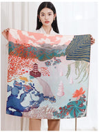Model holding the two lakes silk scarf open to show the full landscape print