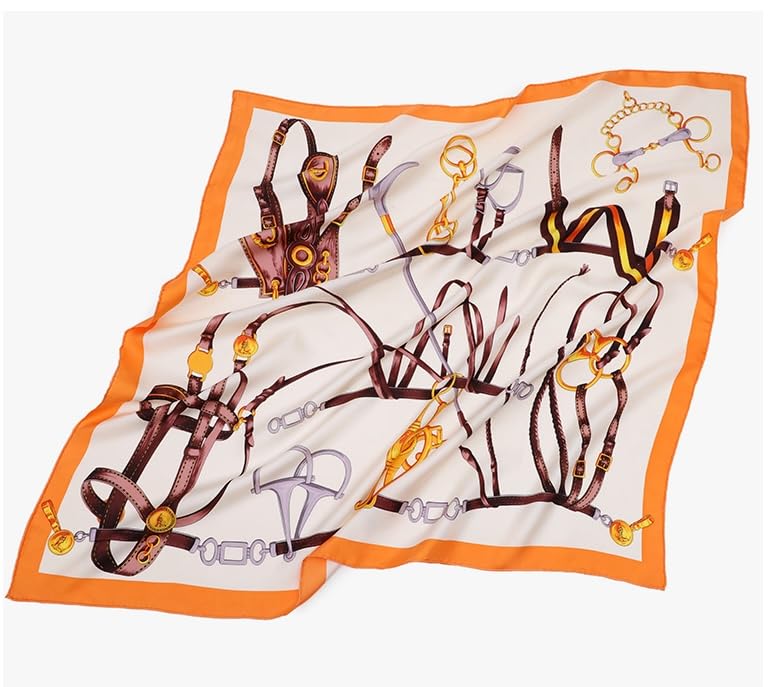 The bridle print silk scarf laid flat at an angle showing the full orange framed design