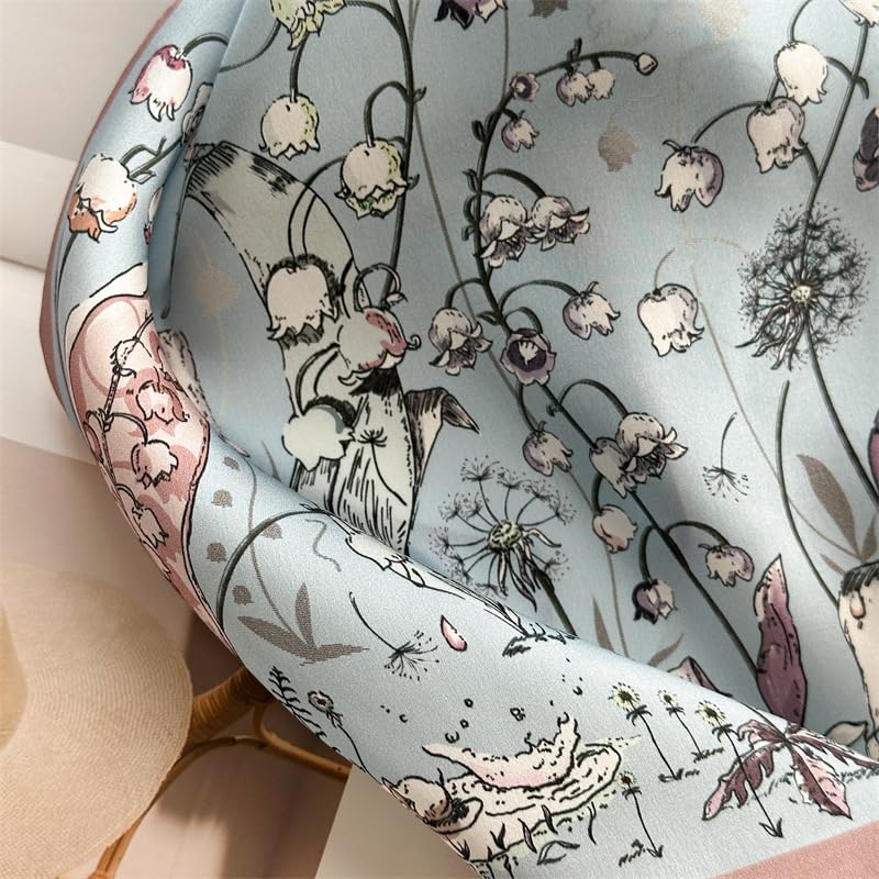 Close-up of the rose border curving over folds of misty blue silk with white bellflowers
