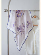 Iris square hung as a diamond on a rail, purple blooms centred on dusty mauve