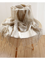Plaid linen scarf styled with a knot at the front