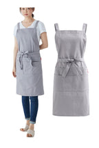 Woman in a light grey cotton twill apron next to the same apron shown flat