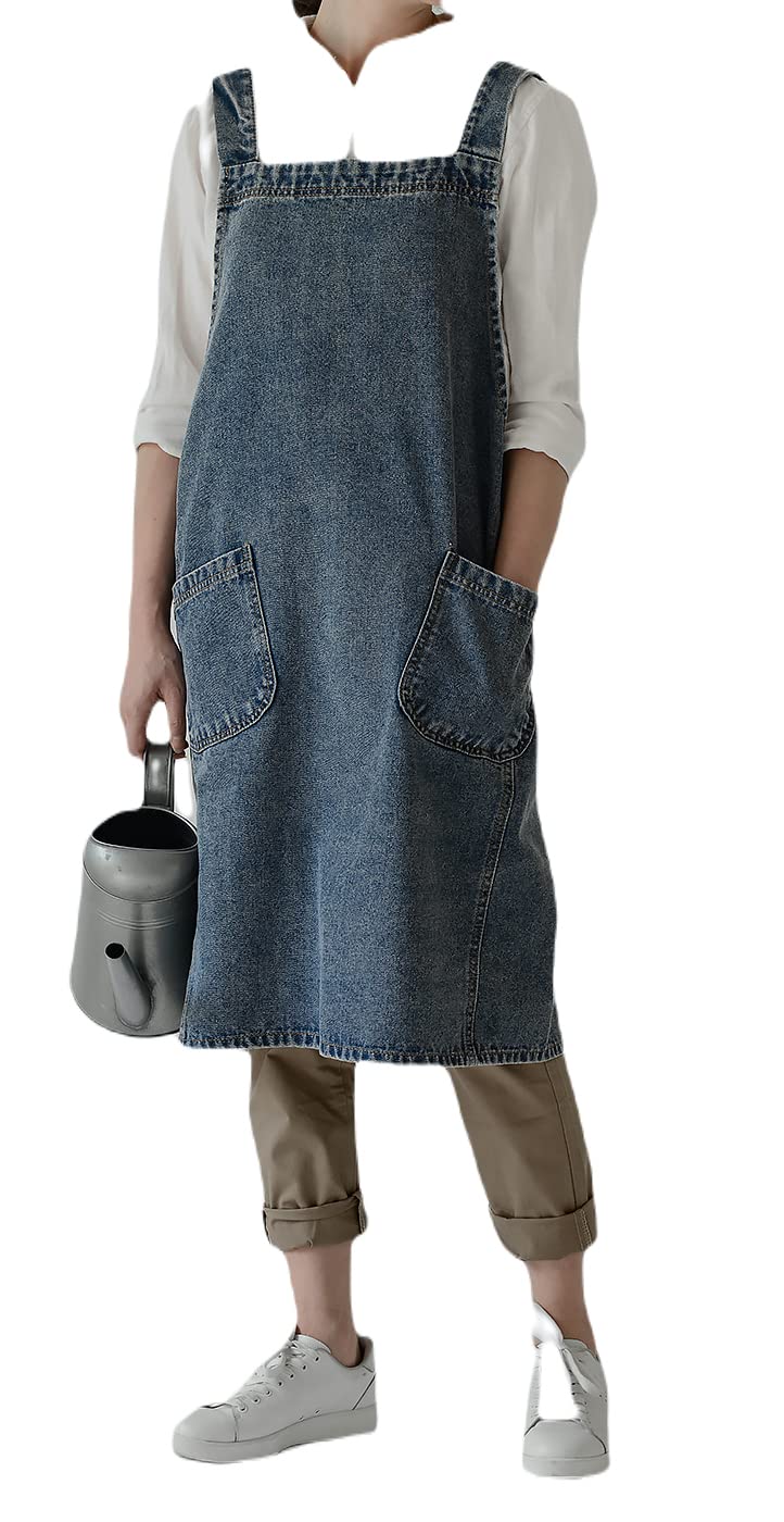 Woman in the mid blue denim pinafore apron holding a watering can
