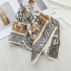 Cream square draped in folds, giraffes and big cats in gold beside the grey border
