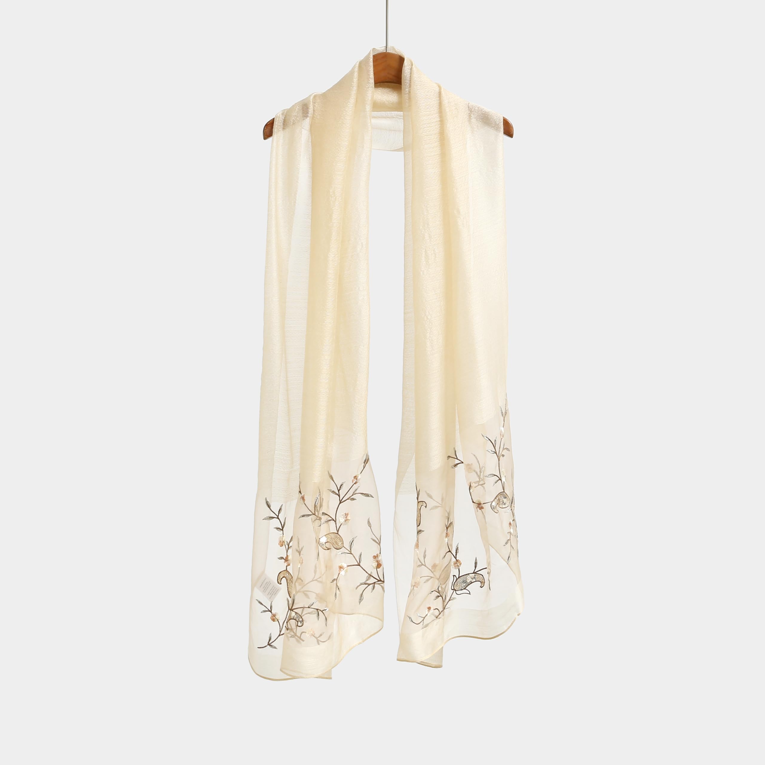 Khaki shawl hung straight showing full length and the vine pattern