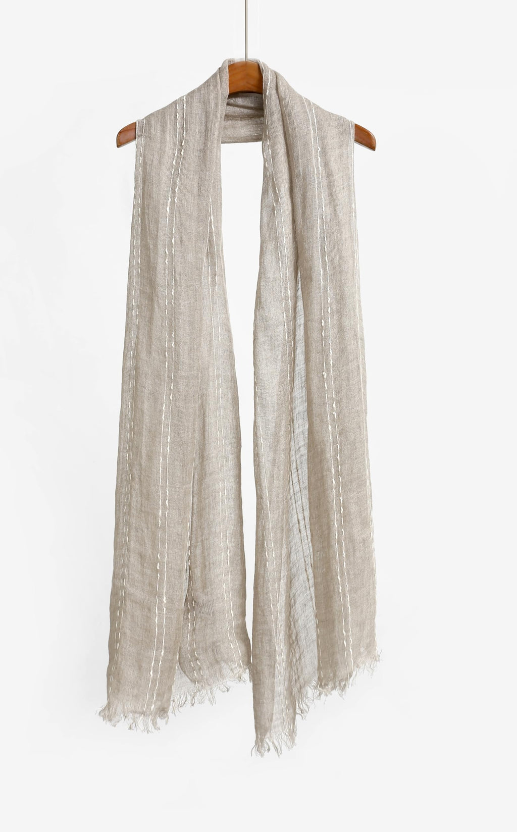 Slub stripe linen scarf draped to show the open airy weave