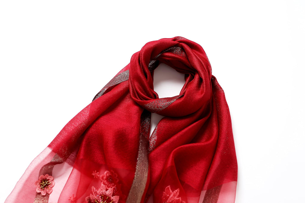 Red shawl looped showing how the beaded end falls
