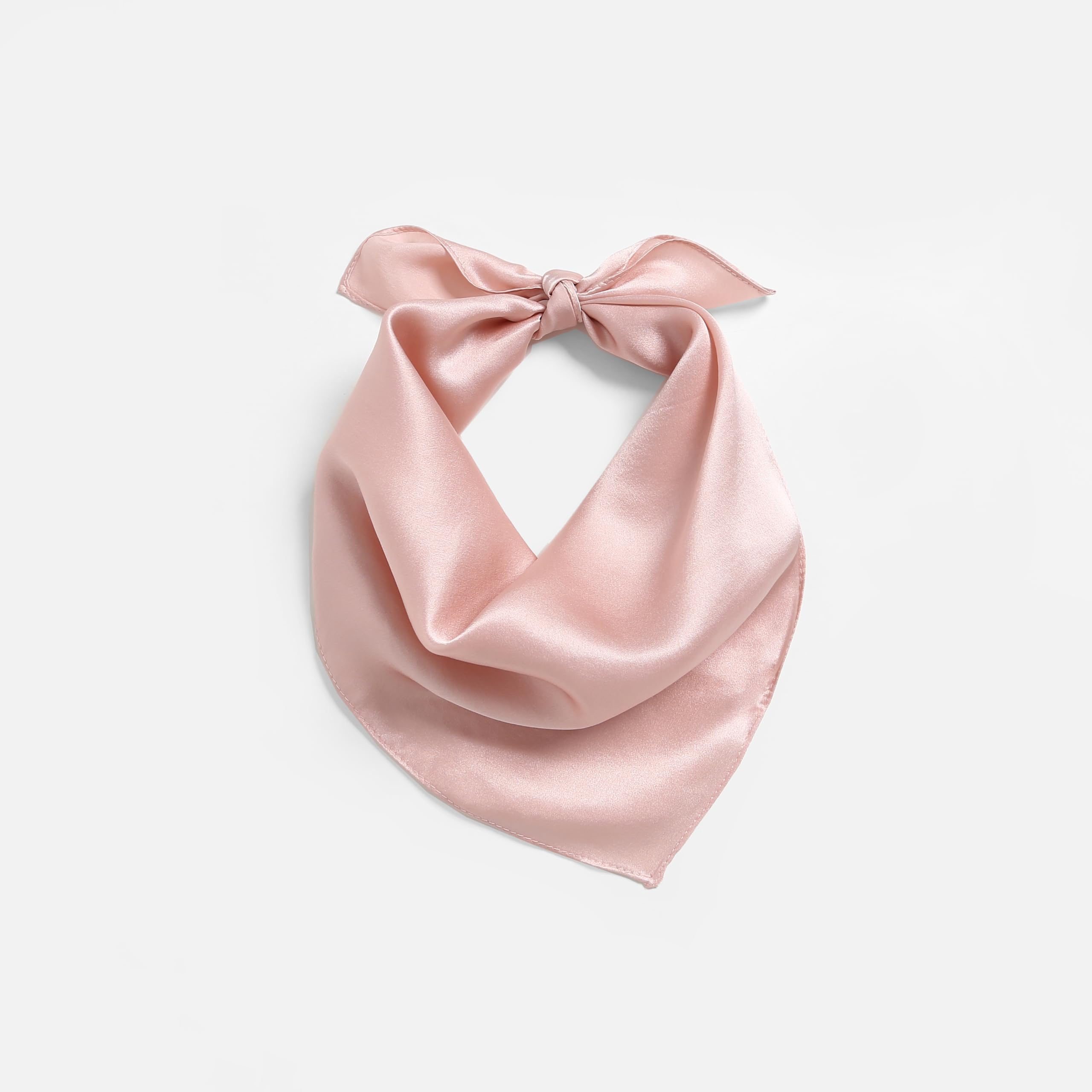 Blush pink silk square folded to a triangle, knot tied at the top of the loop