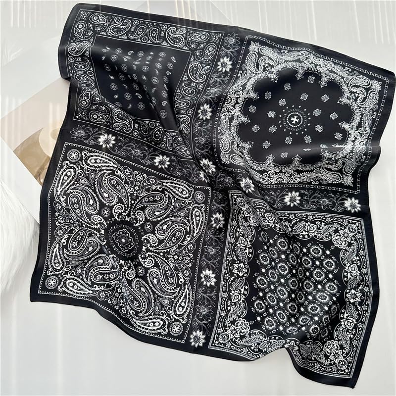 Black paisley square draped over white bedding, medallion centre and daisy edging