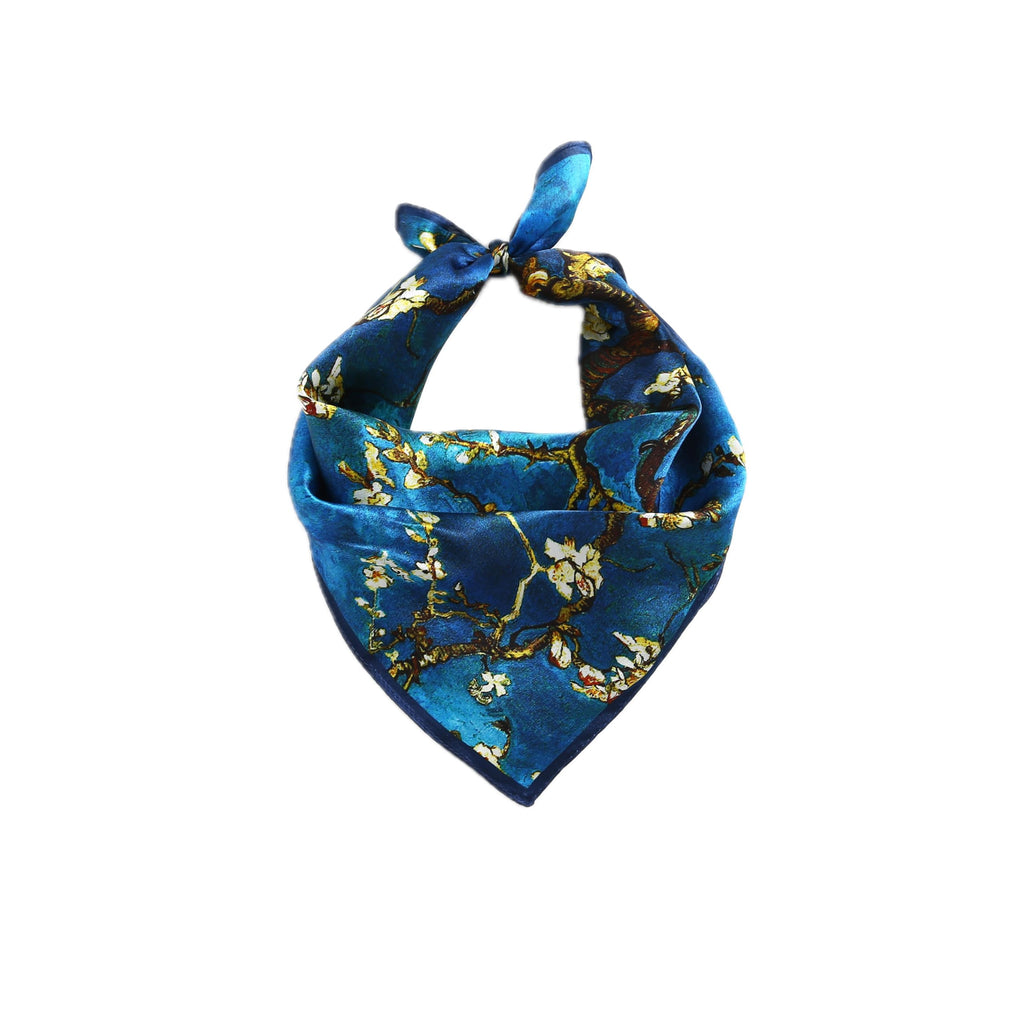 Blue almond-blossom square folded to a triangle and knotted at the top