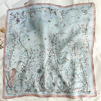 The whole square flat, white lily-of-the-valley sprays on misty blue, rose pink border