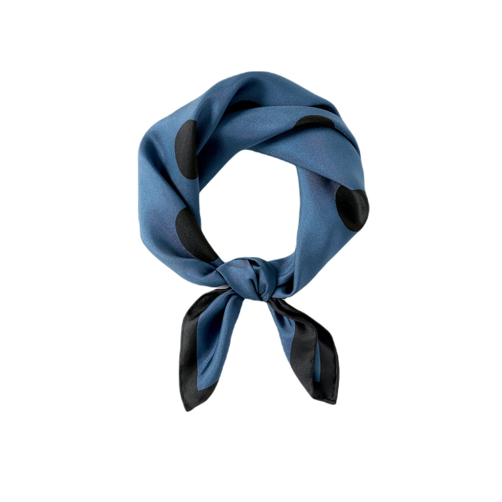 Steel blue silk twill neckerchief with black dots, looped and knotted with black tipped tails