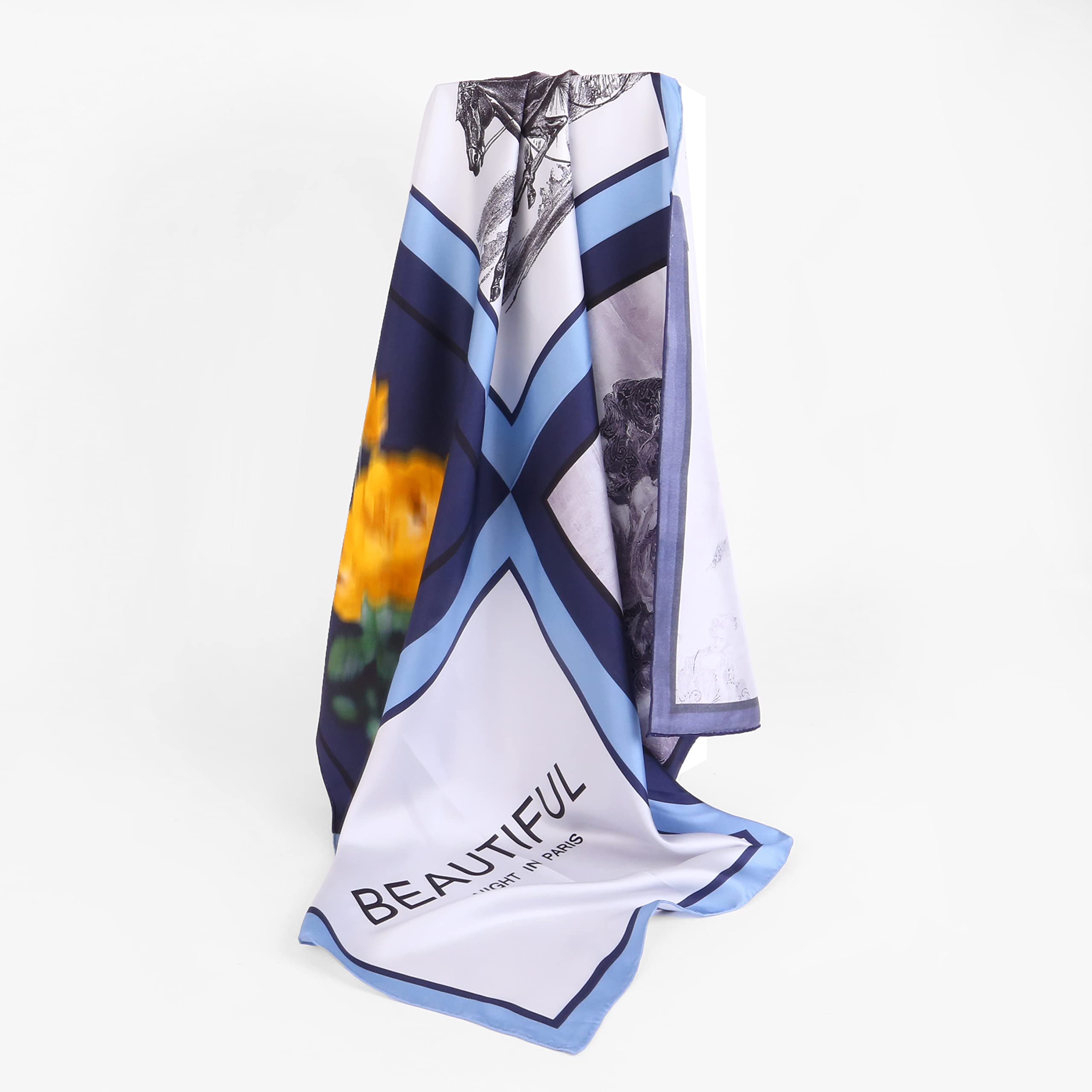 The nocturne silk scarf gathered to show the navy sky blue and white bands