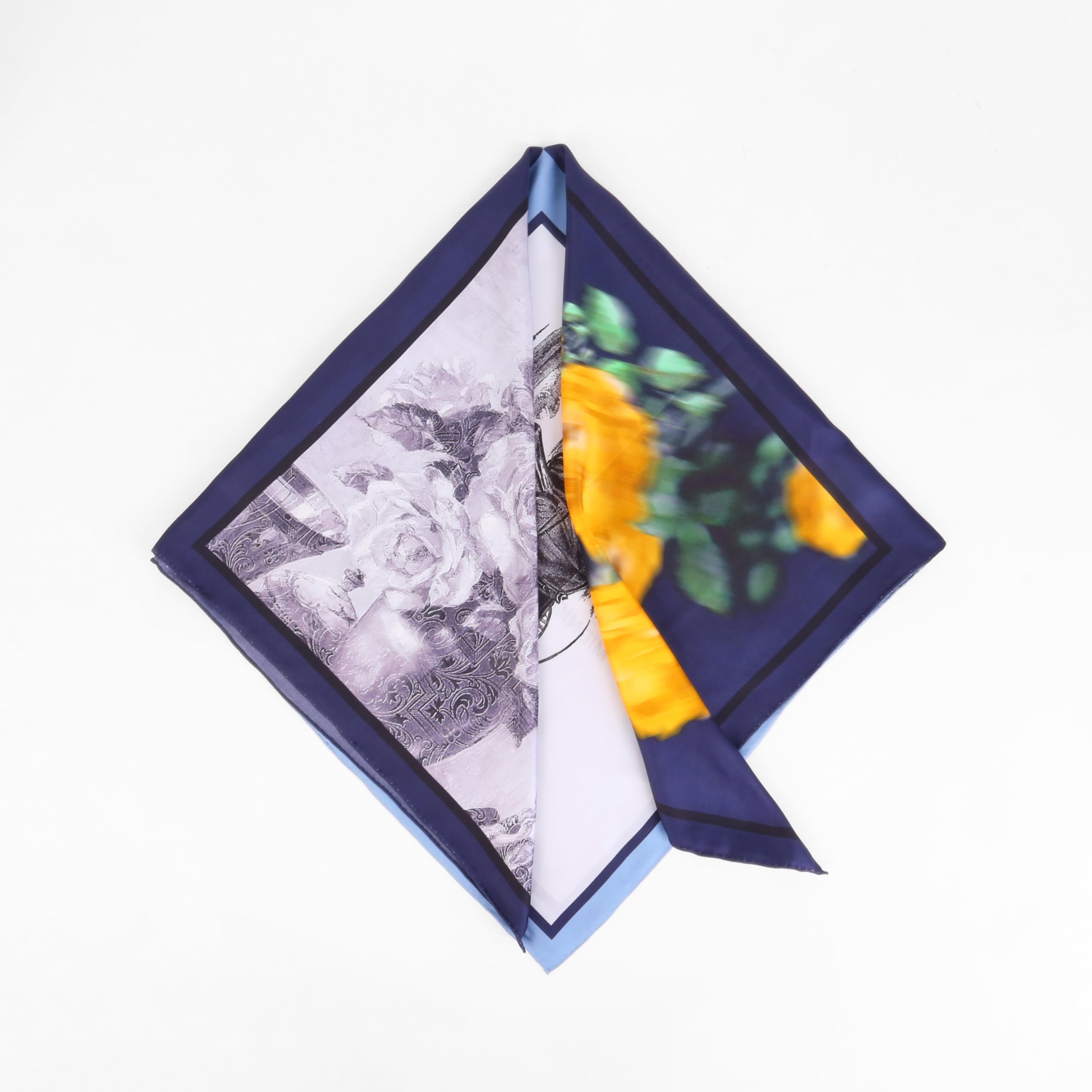 The colour block silk scarf folded into a square showing the engraved rose panel