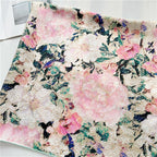 Flat view of the painted garden silk scarf showing roses and foliage edge to edge