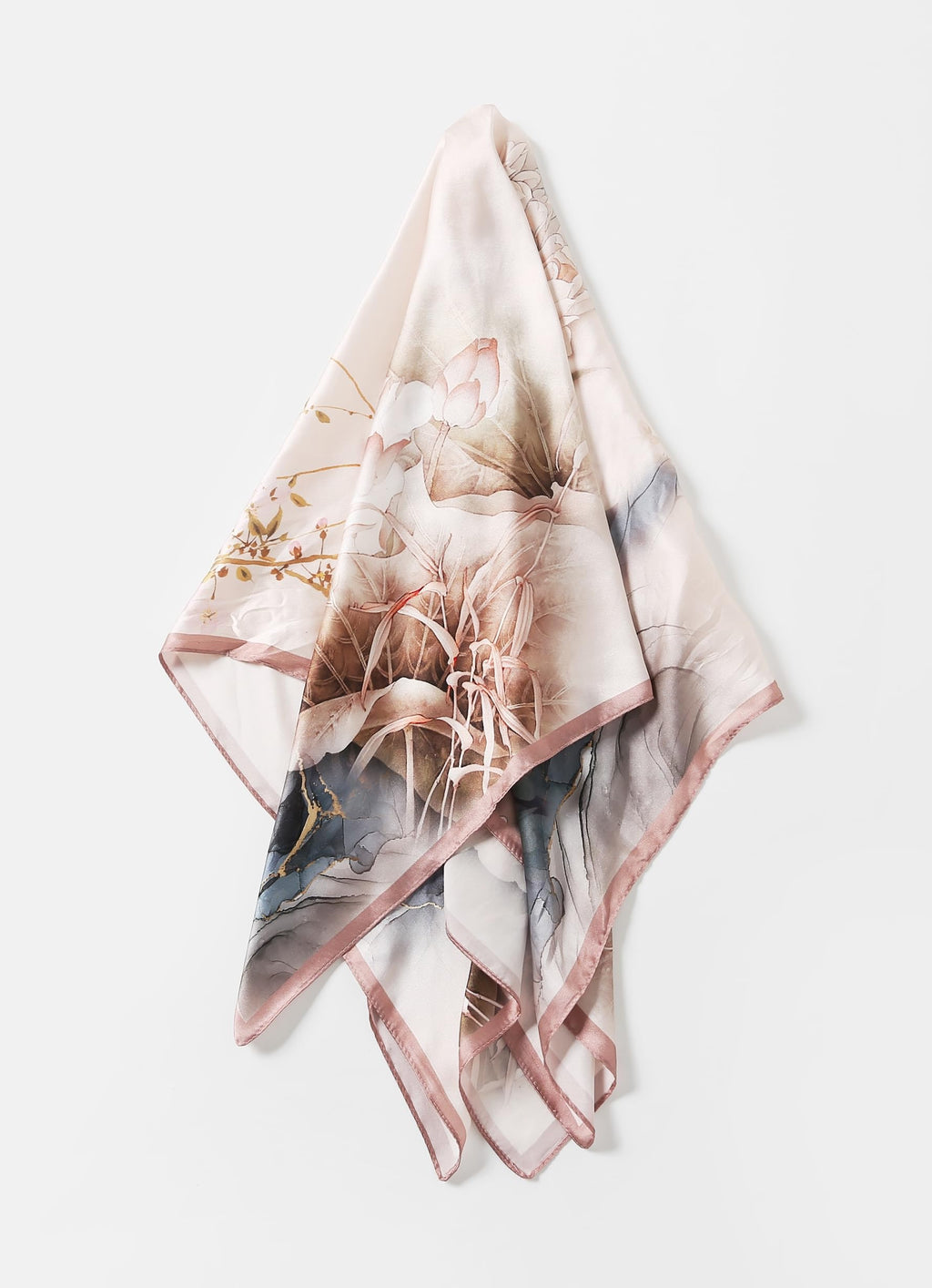 The ink lotus silk scarf folded into a triangle showing the dusty rose border