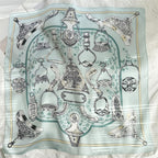 The whole aqua square flat, stirrups and buckles in black line inside a gold frame
