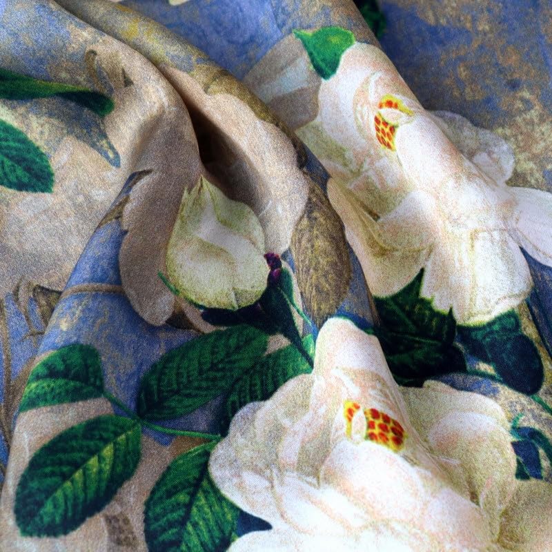 Macro of cream camellia blooms and glossy green leaves printed on periwinkle silk