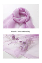 Two views of the lavender shawl knotted and its purple floral embroidery