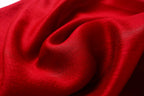 Close up of the deep red fabric folds