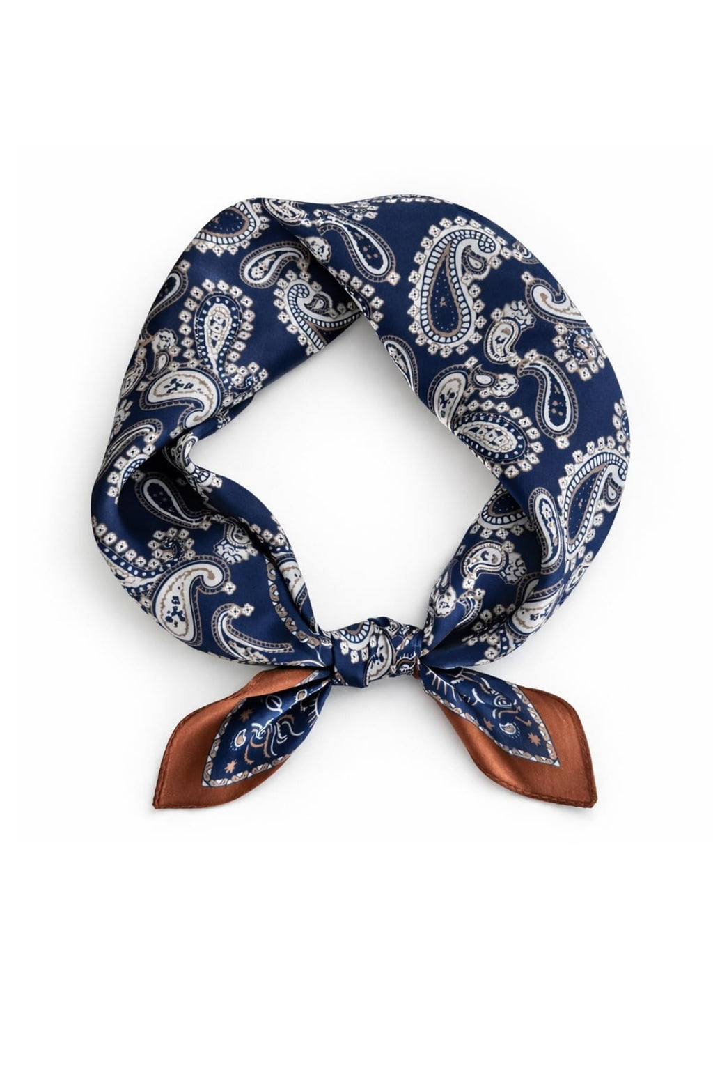 Navy paisley silk square knotted into a loop, rust border tails pointing down