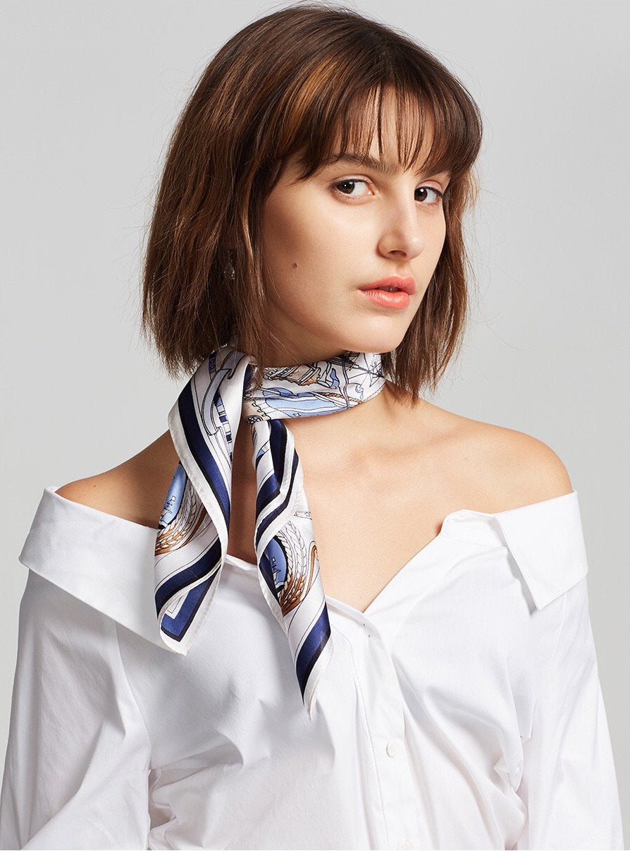Woman in a white shirt with the tall-ships square tied close around her neck