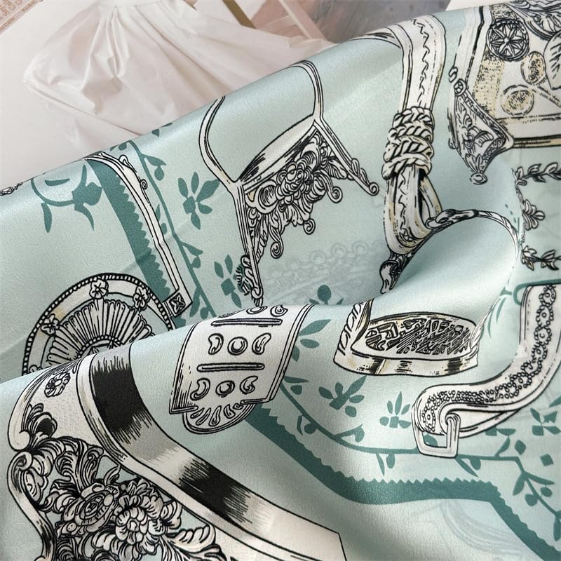 Close-up of aqua charmeuse folds, engraved stirrups and tasselled harness in fine line