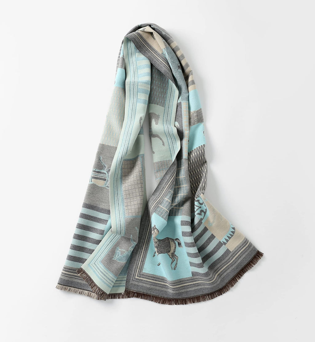 The pale blue shawl hanging in soft folds with the brown fringed ends visible at the bottom