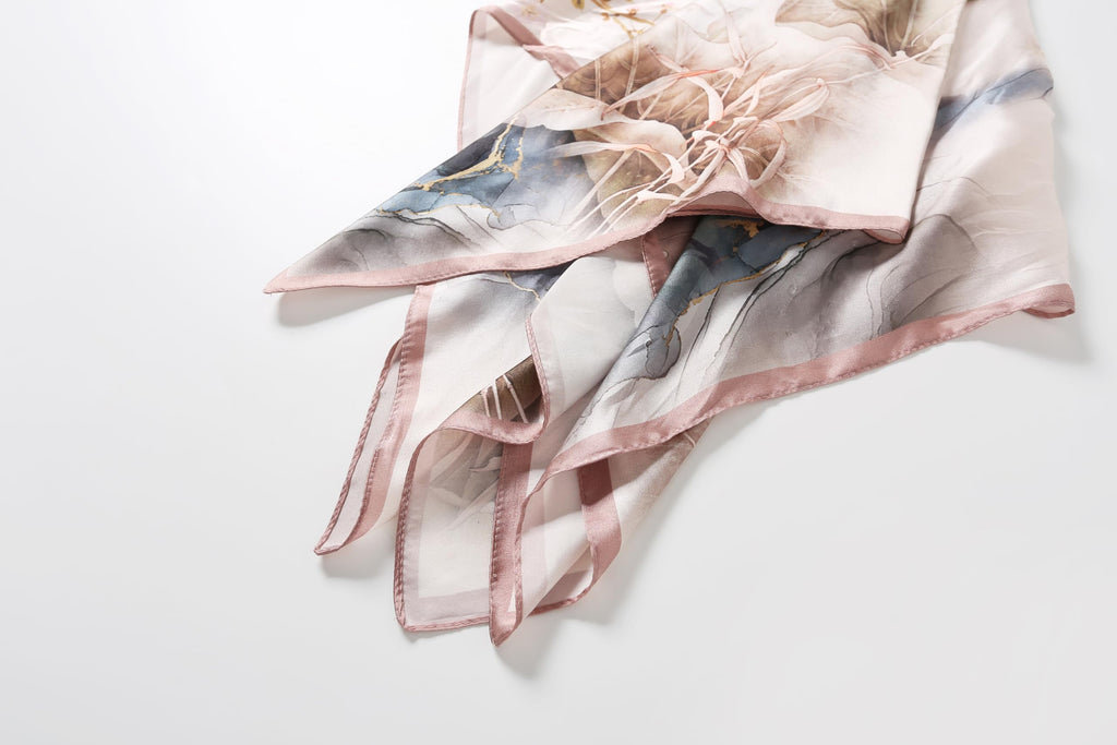 The ink wash lotus silk scarf knotted showing the indigo leaf motif